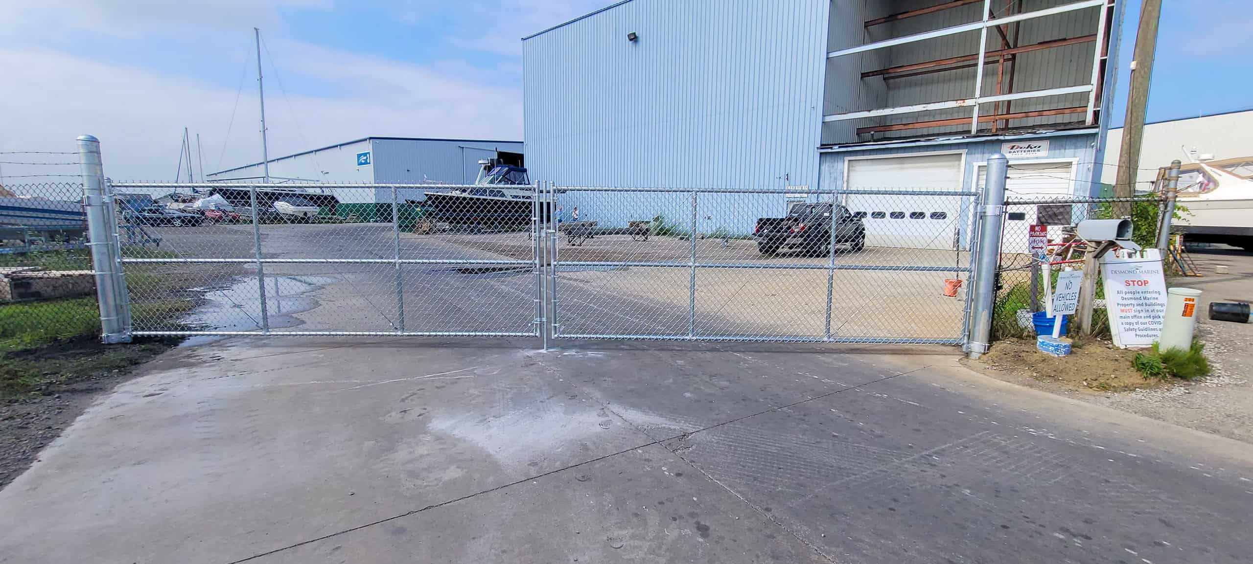 Chain-link gate at fenced industrial facility